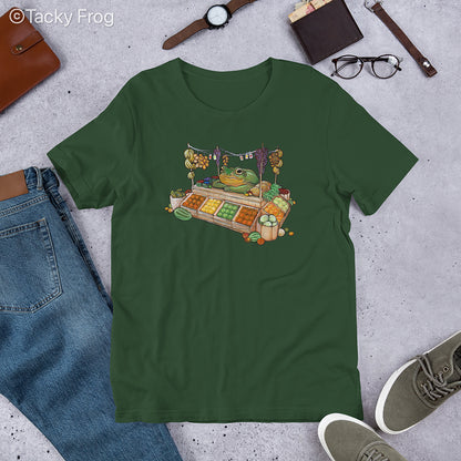 A mockup of the fruit vendor frog shirt in the color Forest.