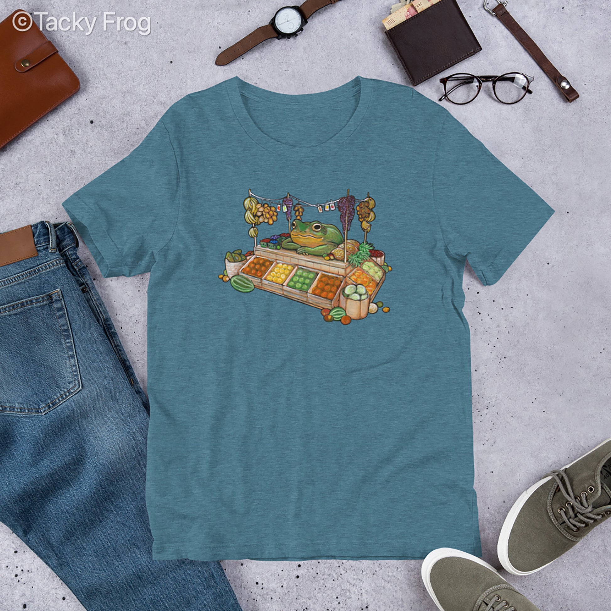 A mockup of the fruit vendor frog shirt in the color Heather Deep Teal.