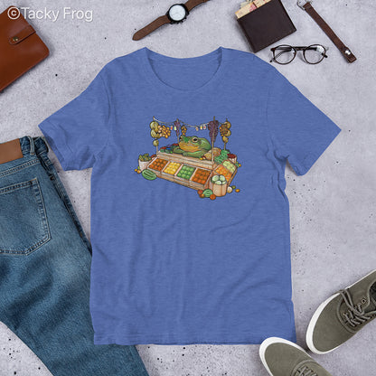 A mockup of the fruit vendor frog shirt in the color Heather True Royal.