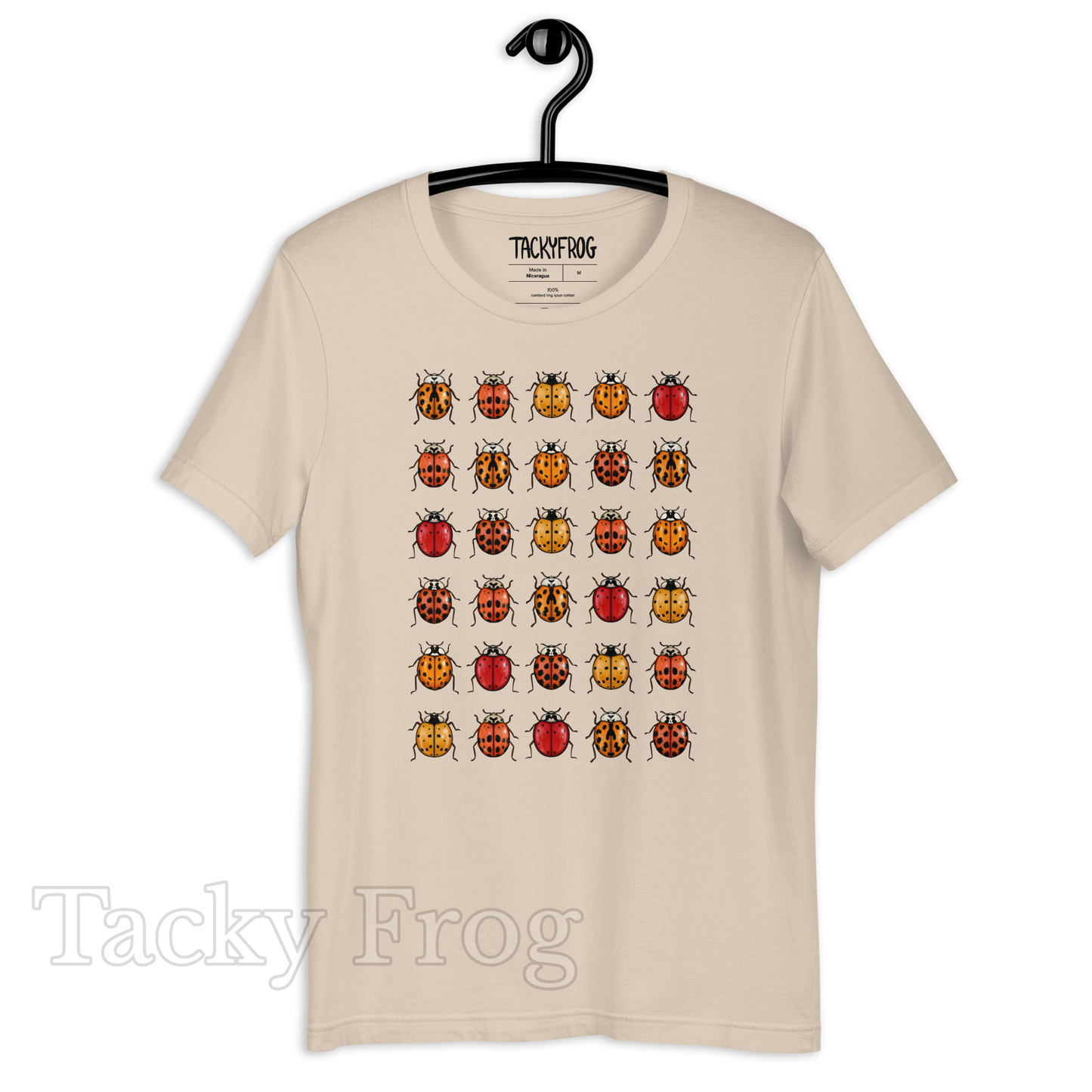 A mockup of the soft cream-colored ladybug t-shirt.